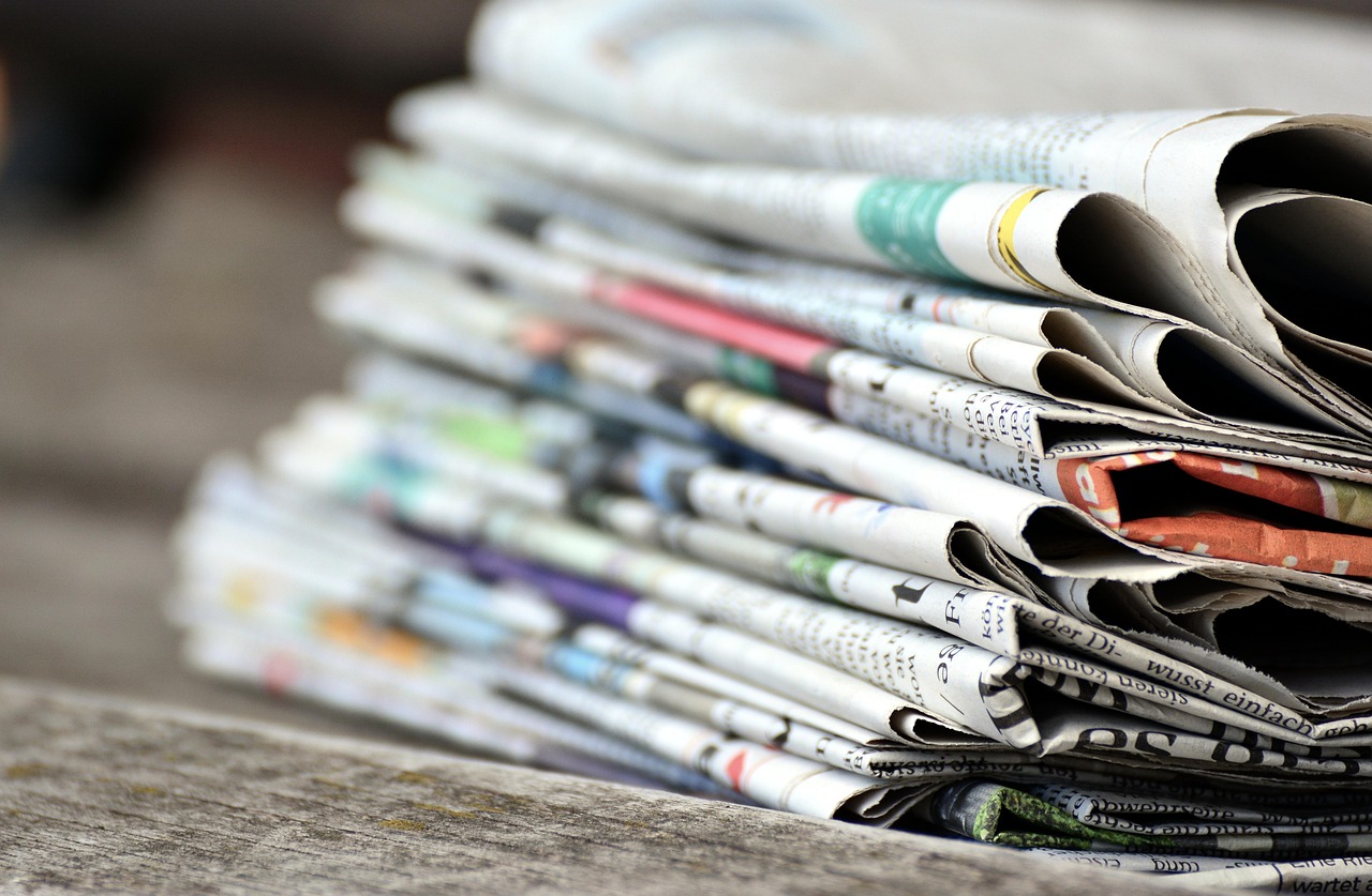 Newspapers, pile of newspapers, press — Gap Year Abroad Program to Gain Real-World Experience
